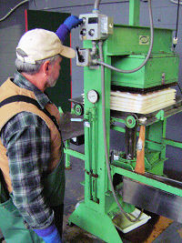 Bob adjusts pressure on the 7 trays of pommage