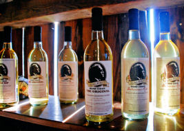 Several labeled Bottles of Colonel Ricketts Hard Cider